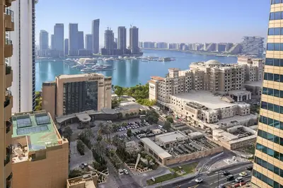 an aerial view of a city with a river and buildings at Elegant 2BR - Stunning Sea Views & Prime Location in Dubai