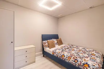 a bedroom with a bed and a dresser in it at Lux 4BHK in JBR 5 Mins Walk to Beach Sadaf 2 404 in Dubai
