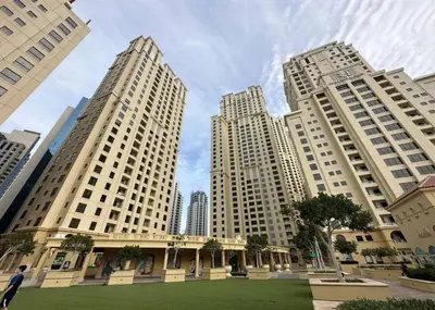 three tall buildings in a city with a park at Lux 4BHK in JBR 5 Mins Walk to Beach Sadaf 2 404 in Dubai