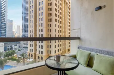 a table in a balcony with a view of a city at Lux 4BHK in JBR 5 Mins Walk to Beach Sadaf 2 404 in Dubai