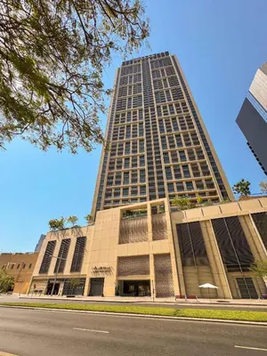 a large tall building with a road in front of it at PVH - Canal View 1BR - Burj Royale in Dubai
