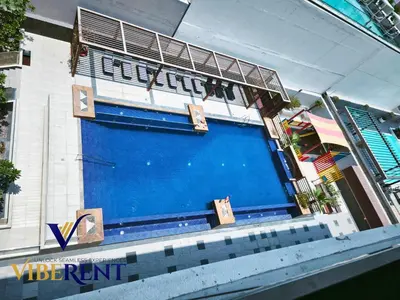 a large blue door on the side of a building at Modern 1BR Apartment with Pool & Gym, 15 Min to JBR in Dubai