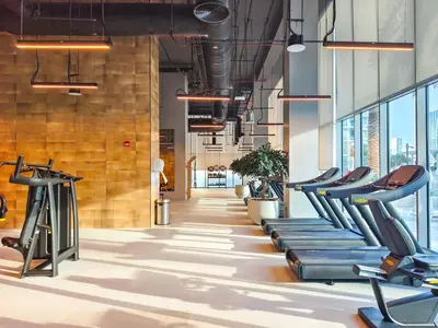 a gym with treadmills and elliptical machines at The Norway Condo - 2BR Burj Khalifa View in Dubai