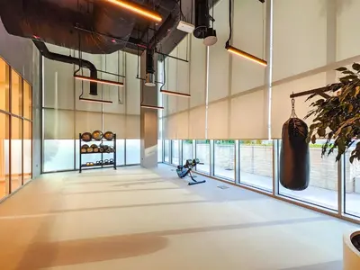 a large room with large windows in a building at The Norway Condo - 2BR Burj Khalifa View in Dubai