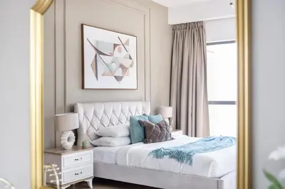 a bedroom with a bed with a large mirror at MiamiDXB Full Sea View -2Bd apartment in Dubai