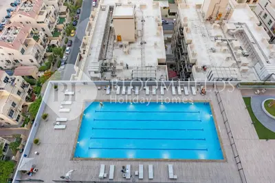 an overhead view of a swimming pool in a building at Bloomfields Spacious 1br Bloom Tower in Dubai