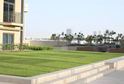 a lawn in the middle of a building at New Luxury 1 Bed - Opposite Dubai Hills Mall in Dubai