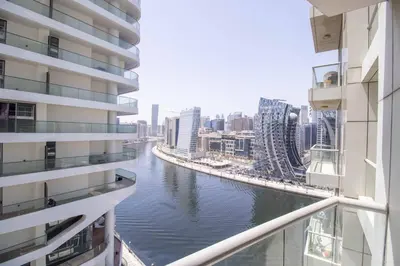 a view of a river between two buildings at Canal-View one bedroom Apt Business Bay in Dubai