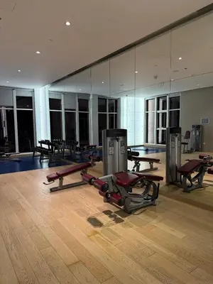 a gym with several exercise equipment in a room at Apartment In Downtown Dubai in Dubai