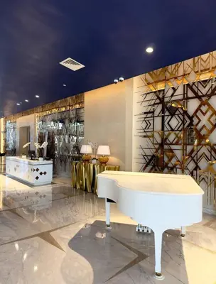 a lobby with a white tub in the middle of a room at Apartment In Downtown Dubai in Dubai
