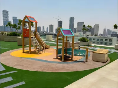 a playground with a slide and a slide at Solysian Stay in Dubai