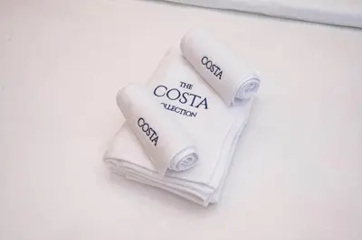 two rolls of toilet paper sitting on a table at Luxe 1BR Suite Dubai Dream Stay with Pool and Gym in Dubai