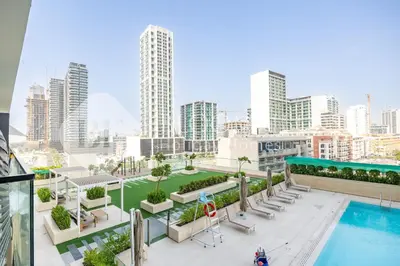 a view of a city from a building with a pool at Bloomfields Modern 1Br Binghatti Onyx in Dubai