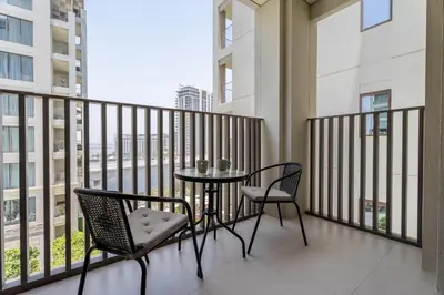 a balcony with a table and two chairs on a balcony at GuestReady - Charming stay at Creek Beach in Dubai