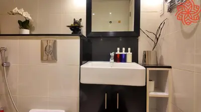 a bathroom with a sink and a mirror at pearl 1bdr apartment in business bay in Dubai