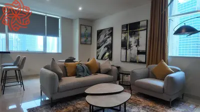 a living room with two couches and a table at pearl 1bdr apartment in business bay in Dubai