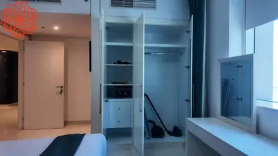 a bedroom with a bed and a closet at Amazing 1bdr apartment in business bay in Dubai
