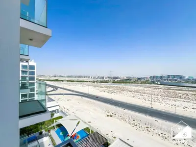 a view of a beach from a building at Serene Luxe l Modern 1BR in Meydan with Pool in Dubai
