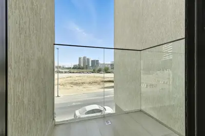 a room with a window with a view of a car at BLVD Boutique Style Apartment Gym Pool Balcony JVC in Dubai