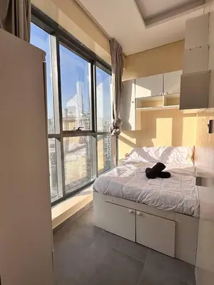 a bedroom with a bed with a large window at Modern Private Hostel Room near Business Bay Downtown in Dubai