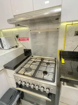 a stove top oven sitting in a kitchen at Modern Private Hostel Room near Business Bay Downtown in Dubai