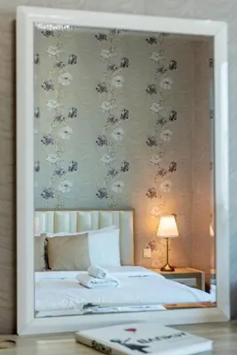 a picture of a bedroom with a bed in a mirror at Marina View, 2BR Ideal for Groups, Walk to beach in Dubai