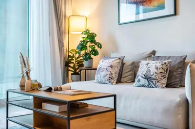 a living room with a couch and a coffee table at Family and Group Friendly Near Beach Metro and Marina in Dubai