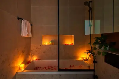 a bathroom with a tub with lights in it at Family and Group Friendly Near Beach Metro and Marina in Dubai
