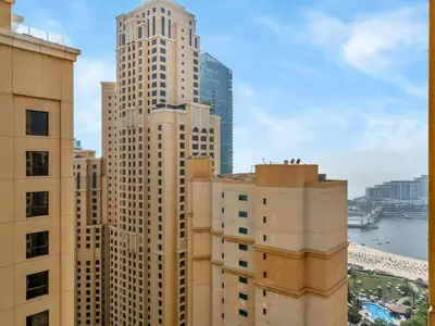 a view of some tall buildings in a city at Comfy 2BR Amwaj 4 Sleeps 10 in Dubai