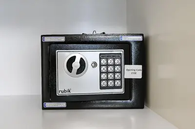 an old fashioned calculator is sitting on a table at Modern 2BR Golfville Dubai in Dubai