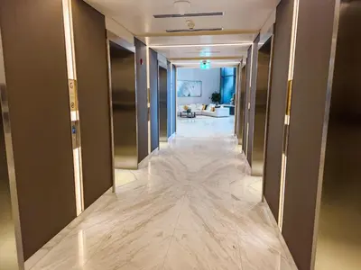 a hallway of a hotel with a long corridor at Stunning 1 Bedroom at Boulevard Point with Infinity Pool connected to Dubai Mall by Luxury Space in Dubai