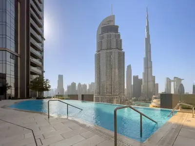 a large swimming pool on the roof of a building at Stunning 1 Bedroom at Boulevard Point with Infinity Pool connected to Dubai Mall by Luxury Space in Dubai