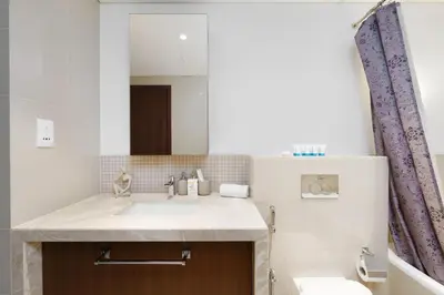 a bathroom with a sink and a mirror at Stunning 1 Bedroom at Boulevard Point with Infinity Pool connected to Dubai Mall by Luxury Space in Dubai