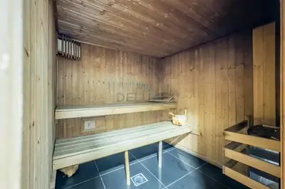 a sauna with wooden walls and wooden shelves at Studio Steps from JBR Beach and Marina Walk, Conveniently located near Ain Dubai, Dec Towers T2, Dubai Marina by Deluxe Holiday Homes in Dubai
