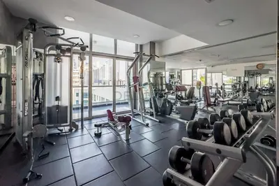 a gym with cardio equipment and a large window at Studio Steps from JBR Beach and Marina Walk, Conveniently located near Ain Dubai, Dec Towers T2, Dubai Marina by Deluxe Holiday Homes in Dubai