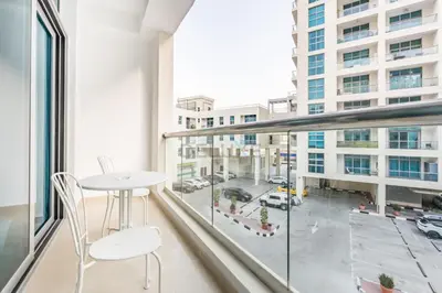 a balcony with a table and chairs and a view of a city at Studio Steps from JBR Beach and Marina Walk, Conveniently located near Ain Dubai, Dec Towers T2, Dubai Marina by Deluxe Holiday Homes in Dubai