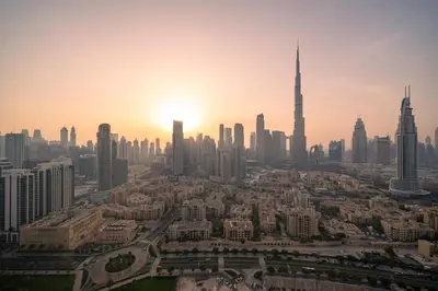 an aerial view of the dubai city skyline at sunset at Full Burj Khalifa Panoramic View - Luxury Stay at Damac Maison Distinction in Dubai