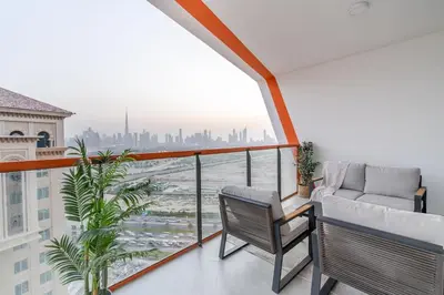 a balcony with a couch and a view of a city at Full Dubai Skyline View on High Floor in Dubai