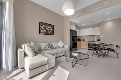 a living room with a couch and a table at Luxury 2BR Downtown Burj View, Heart of Downtown in Dubai