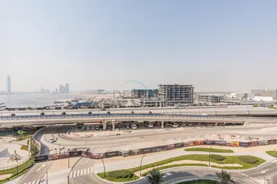 a city with a train station and a freeway at Creek Views 1BR, Short Drive to Ras Al Khor Sanctuary and Festival City Mall, Rosewater at Creek Beach Building 3, Dubai Creek Harbour by Deluxe Holiday Homes in Dubai