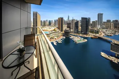 a view of a harbor from a balcony of a building at 1BD Canal View for 4 in Bay Central, Dubai Marina in Dubai