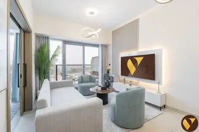 a living room with a couch and a tv at Vogue Damac Hills Golf Gate near First Avenue Mall, Two Bedroom Apartment with Balcony and Vibrant Community View, Access to all Amenities in Dubai