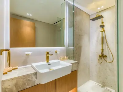 a bathroom with a sink and a mirror at TRPS - Binghatti Lavender, JVC - Premium 1BR Retreat, Fully Furnished in Dubai