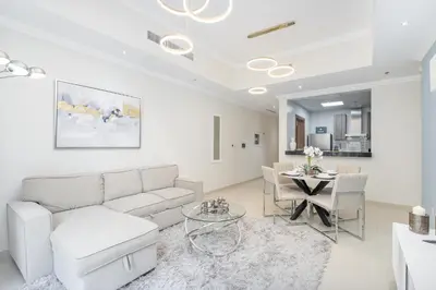 a living room with a couch and a table at Luxury Apartment l 2 min walk from Dubai Mall in Dubai