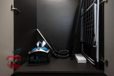 a black room with a door with a fire hydrant at Beautiful Brand New Spacious 1BR in Dubai