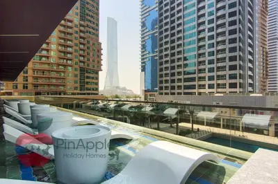 a view of a city with tall buildings and toilets at Beautiful Brand New Spacious 1BR in Dubai