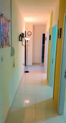 an empty hallway with a clock on the wall at The Pod Partition Room Al Barsha 1 in Dubai