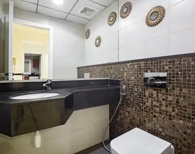a bathroom with a sink and a toilet at Luxury 2BHK in Jumeirah Lakes Towers Icon 3502 in Dubai