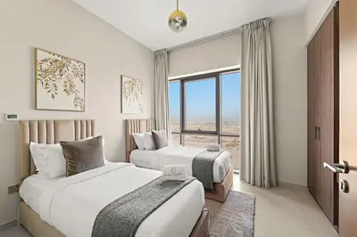 a hotel room with two beds and a window at FIRST CLASS 2BR Creek Beach Relax in Style in Dubai