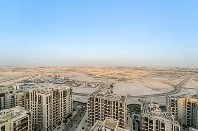 an aerial view of a city with tall buildings at FIRST CLASS 2BR Creek Beach Relax in Style in Dubai